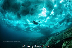 Frozen Surface - in Tobermory Ontario/Canada by Jerzy Kowalczuk 